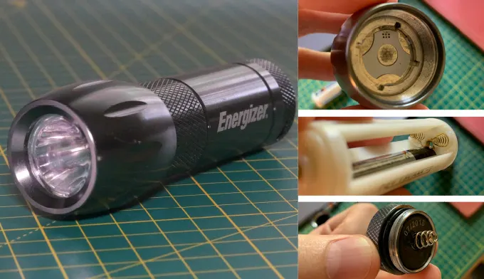 Original Energizer torch on a cutting mat beside close-ups of its disassembled head, battery cradle and tail cap