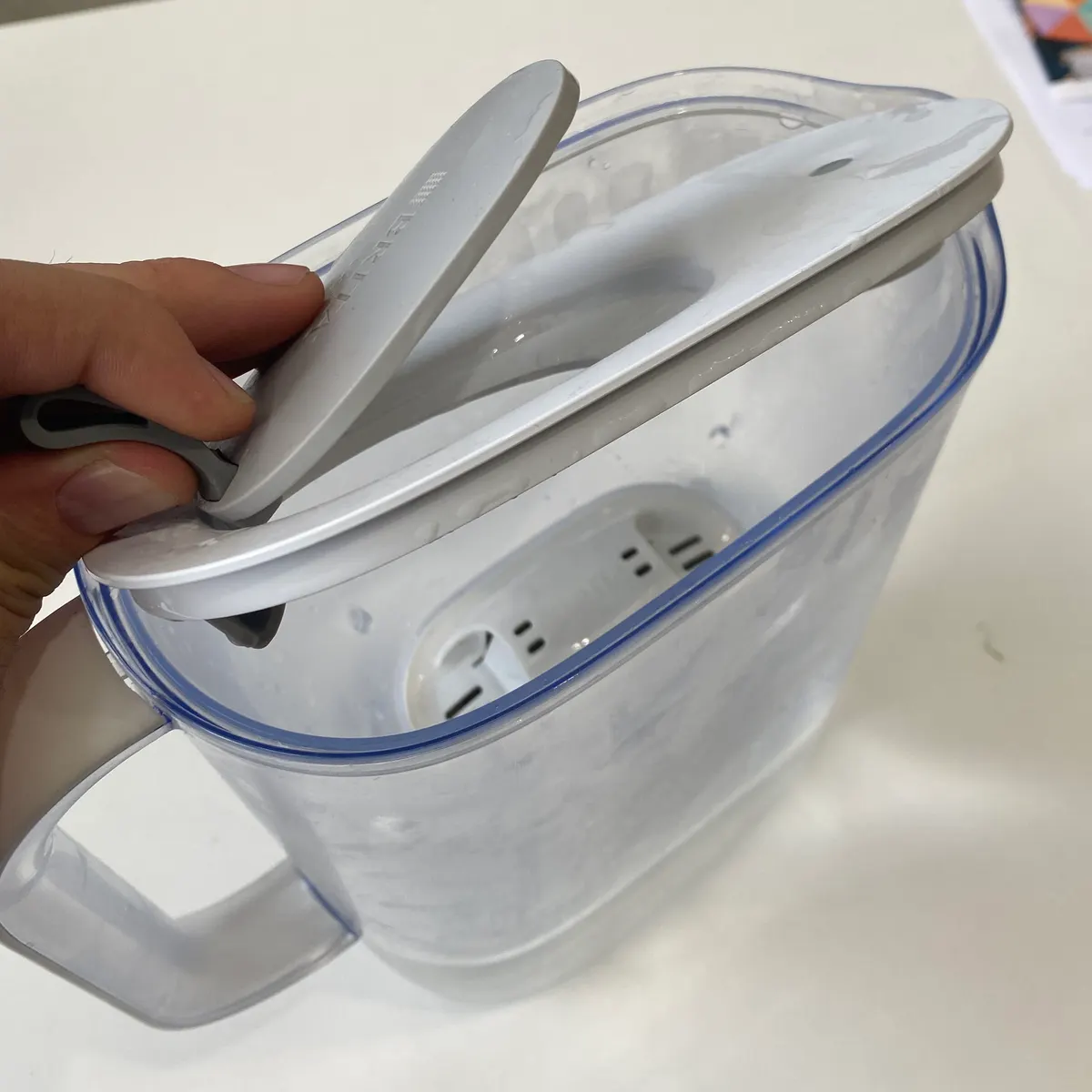 Take the lid off by pulling up on the tab.