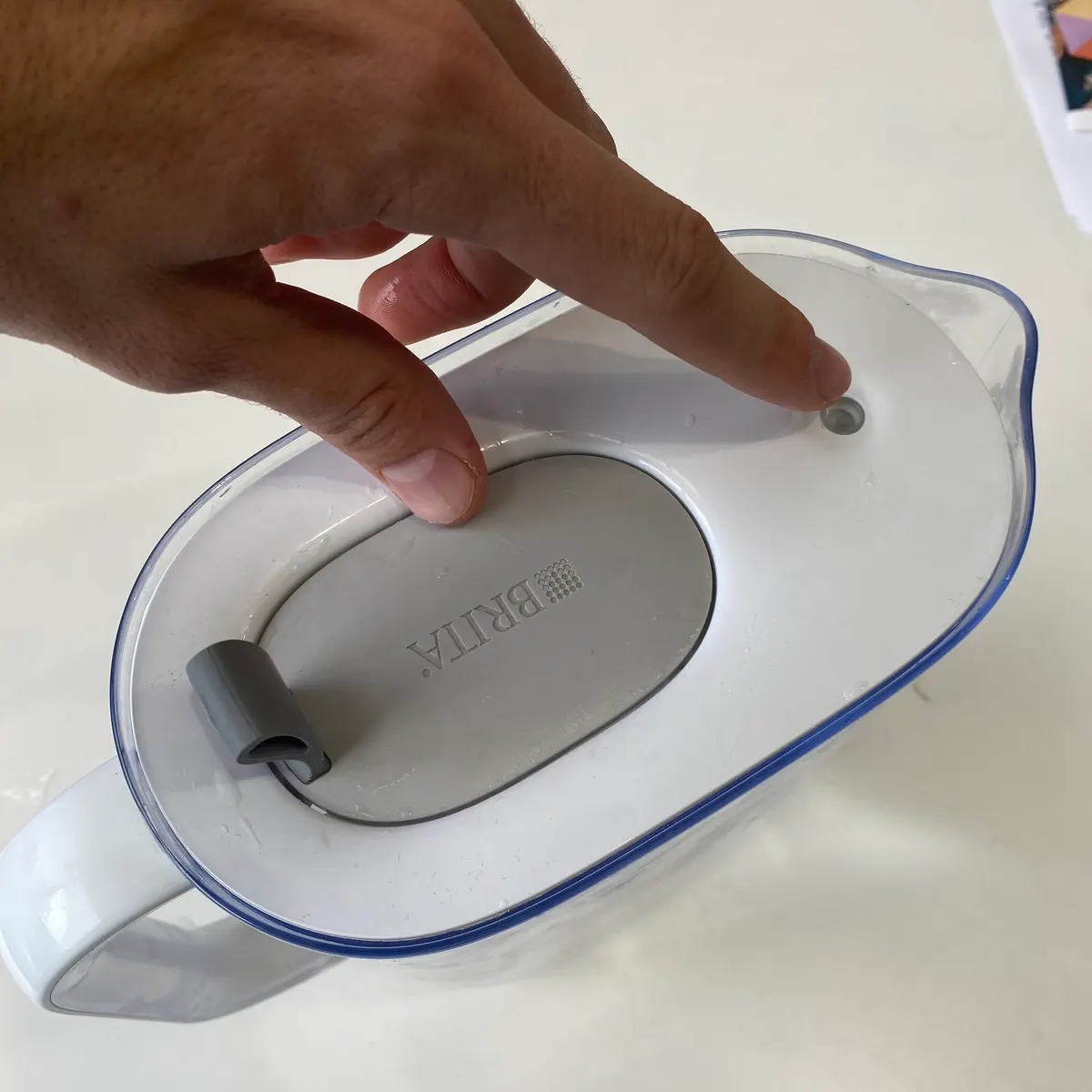 Reset the filter status indicator by holding it down for 8 seconds.